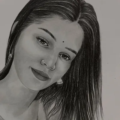 A delicate and expressive pencil portrait of a young woman. This A5 sketch focuses on her gentle gaze and the soft texture of her hair.