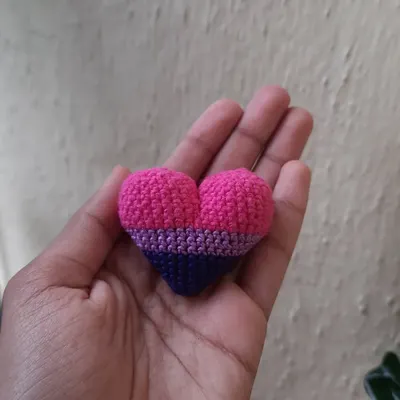 A bisexual pride flag heart. I can make these in two sizes, a larger plush heart or a smaller one for keychains and earrings.