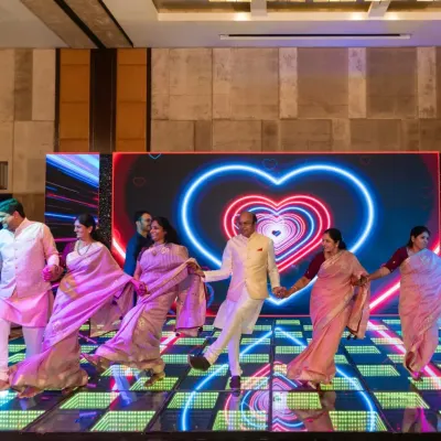 A beautiful family performance with a heart-themed LED background. I love choreographing large family numbers that showcase unity and love.
