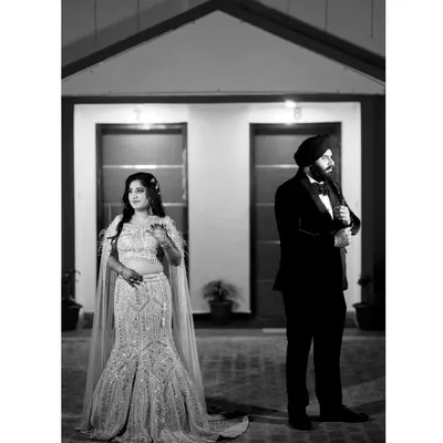 A classic black and white portrait that exudes formal elegance. The separate poses create a sense of anticipation and drama, perfect for a sophisticated pre-wedding or engagement announcement.