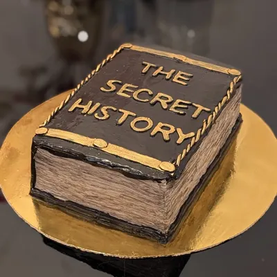 An incredibly realistic book cake. This cake was designed to look like a vintage copy of "The Secret History," complete with textured pages made from icing.