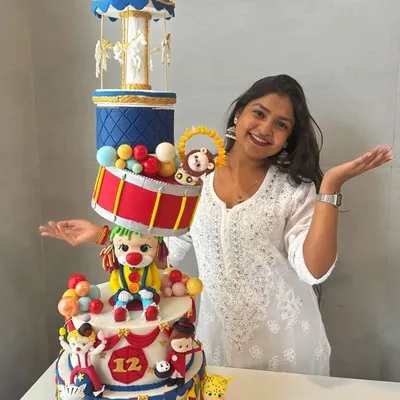 Here I am with one of my proudest creations, a massive, multi-tiered circus-themed cake. This photo was taken to celebrate 6 years of Say Aa Cakes, a journey of turning my passion for edible art into a reality.