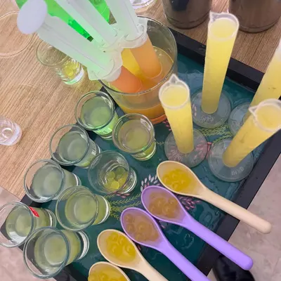 A tray of our most creative offerings: injection shooters, tumbler shots, and "spooner kavias". These are perfect for adding a fun, interactive element to your party.