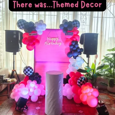 This was the setup for our BLACKPINK themed party, complete with a pink neon sign, a checkerboard and pink balloon arch, and a full sound system. We create an immersive environment that makes kids feel like superstars.