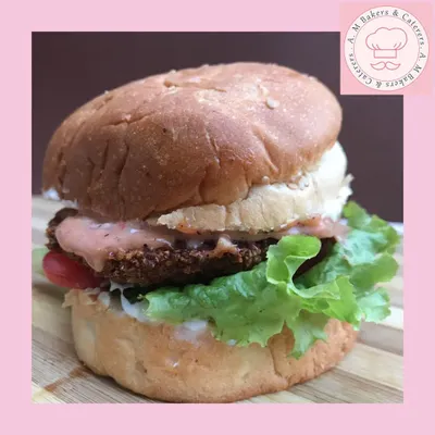 This is my homemade chicken burger. I use a juicy, seasoned chicken patty, fresh lettuce, and my special sauce, all served in a soft bun that I bake myself. It’s a complete, satisfying meal.