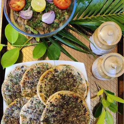 One of our signature pairings: Amritsari Chana Masala served with soft, herb-topped Kulchas. The smoky, spiced chickpeas and fresh bread create a truly comforting and authentic North Indian meal.