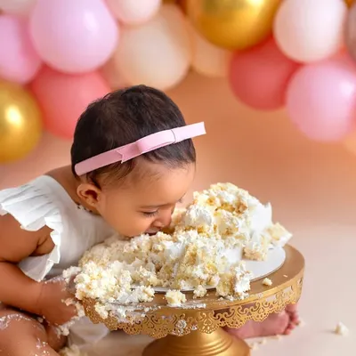 This little one didn't just smash the cake, she went all in! I love it when babies truly enjoy their first taste of birthday cake.