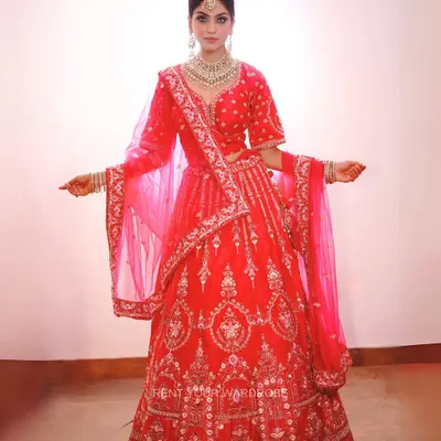 A full view of this gorgeous pink bridal lehenga. The intricate embroidery and matching dupatta make it a perfect choice for creating a classic bridal look for your makeup portfolio.