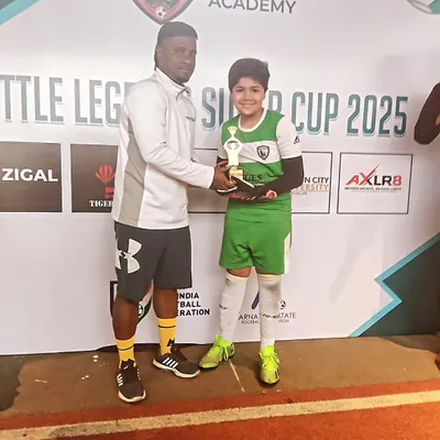 Our U12 goalkeeper, Abdullah, receiving the Best Goalkeeper of the Tournament award. Recognizing specialized skills is crucial for building a player's confidence.