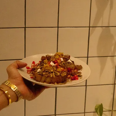 Our cinnamon French toast, topped with kaya jam and house-made granola. It is soft, crisp, and just sweet enough.