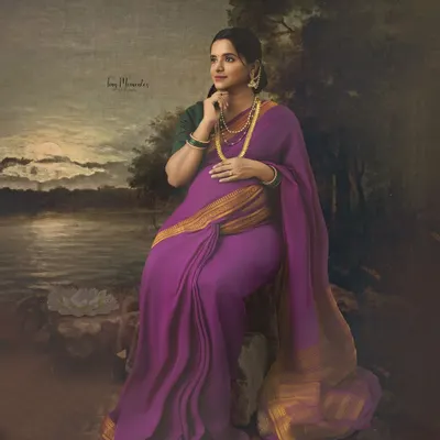 Inspired by the master artist Ravi Varma, this fine art portrait places a mother-to-be in a classic, painterly landscape, transforming a photo into a timeless piece of art.