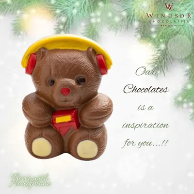 A modern twist on a classic, this milk chocolate teddy bear is ready to rock with detailed yellow headphones and a small red crystal emblem.