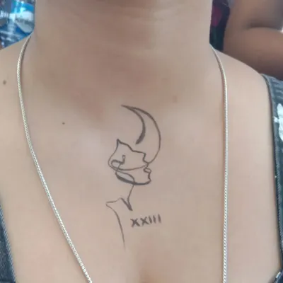 A custom line-art design on the chest. I can recreate your favorite images or symbols for a truly personal temporary tattoo.