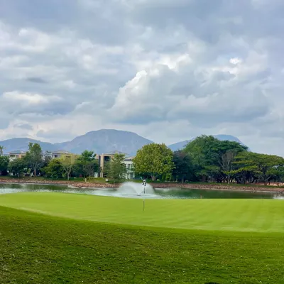 A view of the stunning landscape at one of the courses where I coach. Playing with a backdrop of mountains and water hazards makes every round a memorable experience.