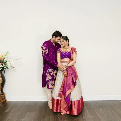 A beautiful moment between a couple, both dressed in bespoke Sindhu Reddy creations. The coordinated purple ensembles are perfect for their special day.