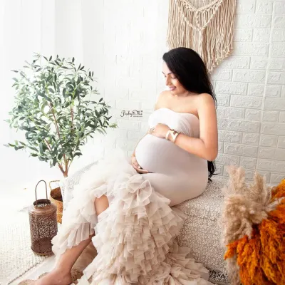 This mama looks so serene and beautiful in my boho setup. The ruffled white mermaid gown is available in my studio and adds such a lovely, soft texture to the photos.