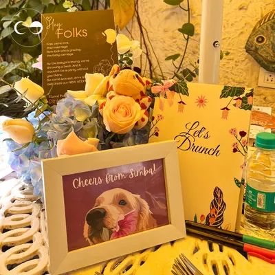 I believe in making every detail personal. This custom table setting includes a framed photo of the family's beloved pet, showing how I incorporate unique, meaningful touches that tell your family's story.