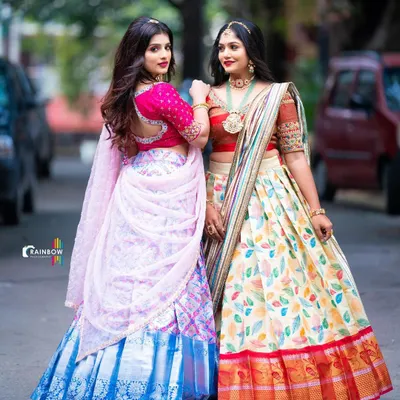 Two stunning and distinct Langa Voni styles available for rent. On the left, a modern printed silk, and on the right, a classic design with a leaf-patterned skirt.