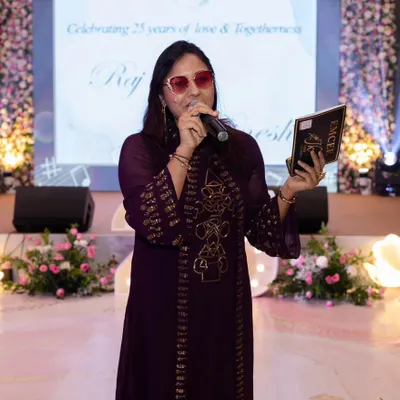 On stage hosting a beautiful 25th wedding anniversary. Celebrating milestones of love and togetherness is always special, and I ensure the event is filled with joy and heartfelt moments.