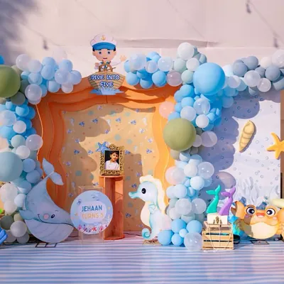 The complete 'Under the Sea' stage setup for Jehaan's 5th birthday. We combined balloon artistry, custom character cutouts, and themed props to create a full underwater scene.