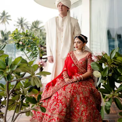 A regal portrait of the couple on a balcony overlooking the sea. We use natural surroundings to frame you, creating a timeless and elegant image that tells a story of romance.