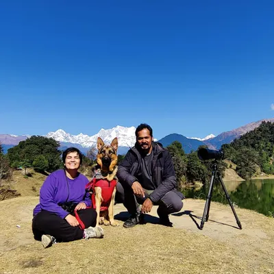 A family portrait with our dog Jiraiya during a trip to Chopta, with the Himalayan peaks creating a breathtaking background. These pet-inclusive vacation sessions are my specialty, capturing your whole family on your greatest adventures.
