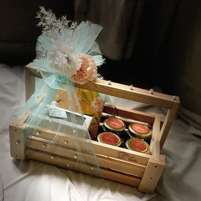 Our most luxurious Rakhi Hamper, presented in a rustic wooden crate. This grand gift contains a box of 16 truffles, brownies, Regal Riches, and multiple jars of our cookies and choco almonds, making it the ultimate celebratory gesture for your sibling.