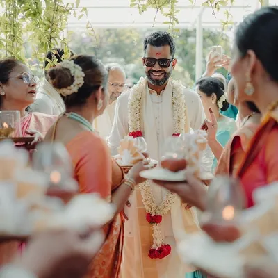 The groom's grand entrance, surrounded by family in a traditional welcoming ritual. I coordinate every part of the ceremony to ensure it flows smoothly and joyfully.
