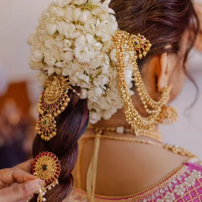 A detailed look at a traditional South Indian bridal braid. In my class, we dive deep into techniques for weaving flowers and gold accessories seamlessly into the hair for a rich, cultural look that is both secure and beautiful.