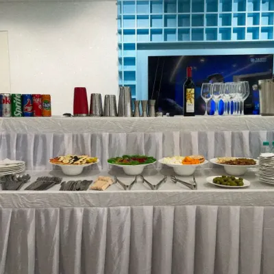A complete beverage station we set up for a corporate event. The setup includes a selection of wines, soft drinks, and a full range of our glassware, all neatly arranged for self-service or bartender assistance.
