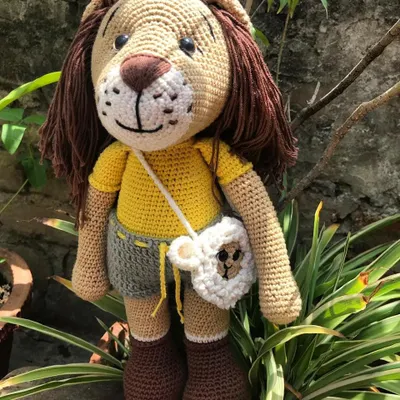 Here is Jireh the lion, standing tall with his lamb bag. I used a soft brown yarn for his magnificent mane and dressed him in a yellow shirt and grey shorts.