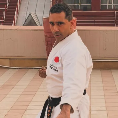 A moment of focus before training begins. As a black belt and instructor, I believe that every day presents a new opportunity to refine my technique and deepen my understanding of the art.