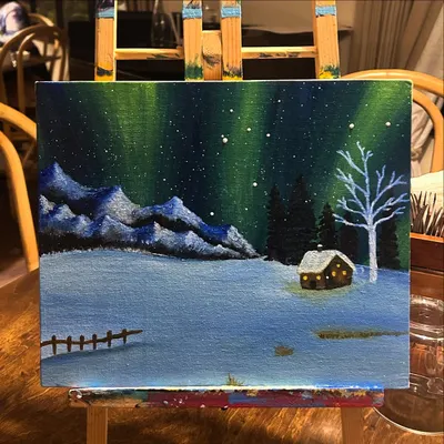 A beautiful Northern Lights painting on an easel. This is one of my most popular themes, and I'll show you how to blend the colors to create that magical glow.