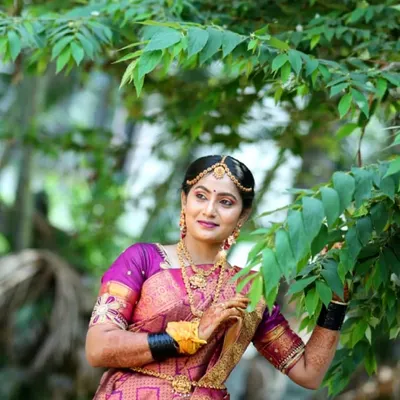 A beautiful outdoor shot of my bride Gagana. The natural light highlights the flawless makeup base and the rich colors of her silk saree.