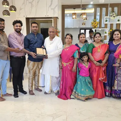 A proud moment with a happy family at their housewarming ceremony. Handing over a completed home to our clients is the most rewarding part of our work.