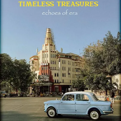 A classic Fiat car parked before an Art Deco building, capturing the "Timeless Treasures" of Mumbai. This shot perfectly blends vintage automotive design with the city's unique architecture.