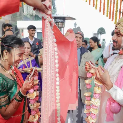 The 'Antarpat' ritual in a Maharashtrian wedding is full of sweet anticipation. We captured the moment just before the cloth is lowered, as Ketaki and Abhimanyu prepare to see each other for the first time at the altar.