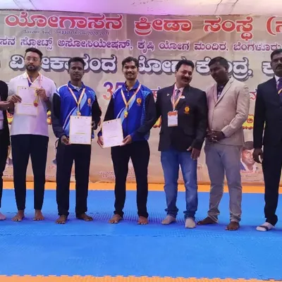 Here I am with fellow athletes after securing first place at the 5th Karnataka State Level Yogasana Competition. This victory qualified me for the national championships.