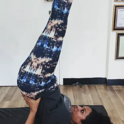 A student holds Sarvangasana (Shoulder Stand), a powerful inversion that calms the nervous system and improves circulation. I believe every student has untapped potential, and my role is to help them discover it safely.