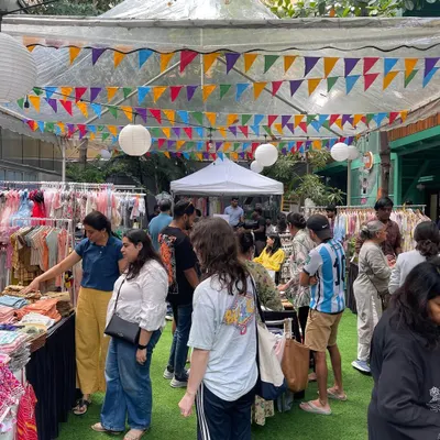 A snapshot of the lively atmosphere at one of my events. Families are browsing through stalls decorated with colorful bunting, discovering all the wonderful products our vendors have to offer.