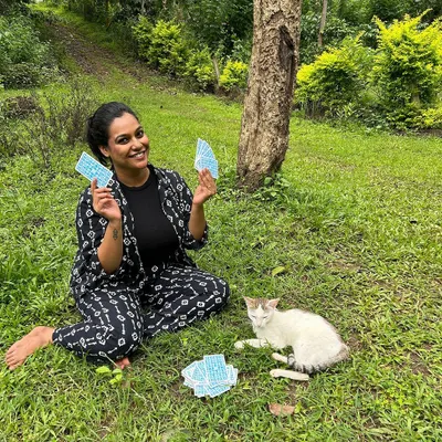 At my happiest, sitting in the grass with my cards and a sweet cat. This is pure bliss for me. I am available for personal tarot sessions or to help you learn tarot yourself.