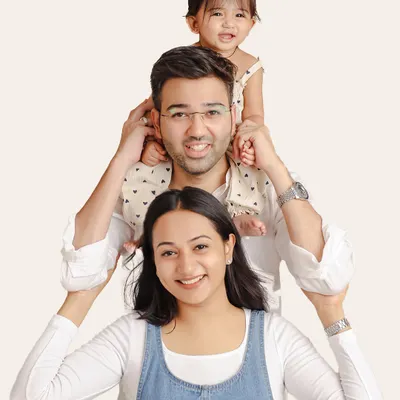 I love getting creative with family poses. This playful "totem pole" arrangement is a fun way to capture the family's personality and create a photo that is full of smiles and laughter.