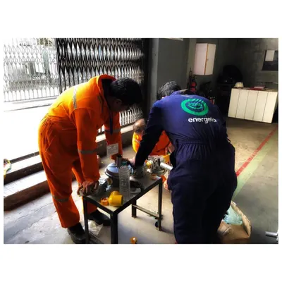 My engineers working together on-site to prepare components for a dual fuel kit installation. This hands-on teamwork is essential to ensuring every project is executed with precision and care, enabling sustainability from the ground up.