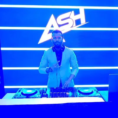 My signature 'ASH' logo displayed on a massive LED screen behind me. This VDJ setup adds a professional and concert-like feel to any corporate event or festival.