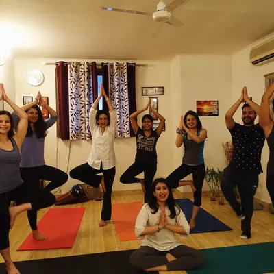The beautiful energy of a group class at my Delhi studio. Here we are practicing Vrikshasana, the tree pose, finding balance and strength together as a community.