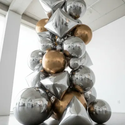 This installation showcases a more sophisticated and modern approach to balloon decor. Using a mix of metallic, geometric, and spherical balloons, I can create an art piece that elevates the ambiance of your office party or high-end product launch.