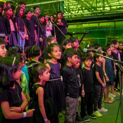 Our amazing student choir lighting up the stage at our annual showcase. It's incredible to see so many young voices come together to create something beautiful.