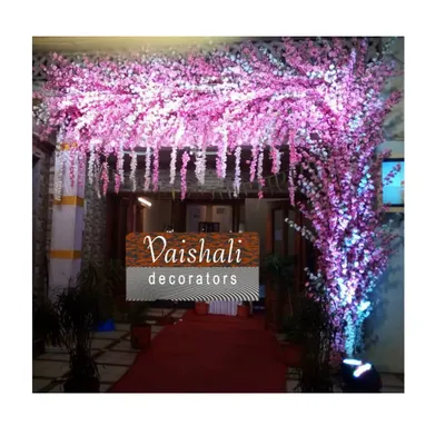 Make a grand entrance with this stunning pink cherry blossom archway. This rental piece is perfect for welcoming guests to a wedding, reception, or any elegant party.