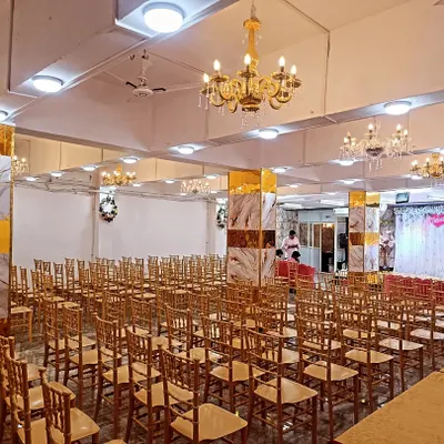 A wide view of our Kalyan West banquet hall, set up for a large gathering. You can see the spacious layout, the elegant pillars, and the ample seating we can provide.