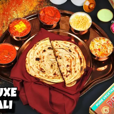 Our most-selling Deluxe Thali is a complete meal in itself. It comes with a selection of our best curries, bread, rice, and sides. Order one and you're sorted.
